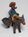 Escultura em barro cozido policromado representando matuto sobre burro de carga. Assinado. Apresenta leves desgastes. 21 x 20 x 16cm.