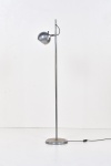 Dominici - Luminária de piso da decada de 1960 executada em metal cromado. Base circular, haste fixa com um spot bolinha articulado e com ajustes de altura. 147 cm.