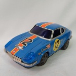 Brinquedo antigo de lata - Lindo carro de corrida fabricado no Japão pela Modern Toys. Mede aproximadamente 19,5cm de comprimento. Funciona com 2 pilhas médias o bate volta.