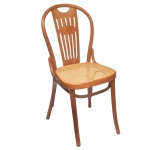 Made in Italy. Séc. XX - Cadeira de madeira clara apresentando encosto vazado e assento em palhinha. 90 x 39 x 41 cm.