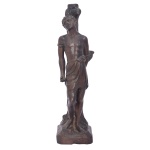 Imagem brasileira em bronze, representando São Sebastião amarrado ao tronco, de pé sobre base chanfrada. 42,5 x 10 x 12 cm.