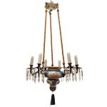 Lustre em porcelana italiana Capodimonte, em tonalidade azul royal, decorada por figuras de anjos e flores e aplicações em dourado. Pingentes em cristal Baccarat. Seis pontos de iluminação, guarnições em bronze e franja de borla pendente ao centro. 100 x 55 cm.