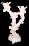 Antigo Castiçal em estuque vitrificado no tom marfim, para duas velas. Mede: 25 cm.