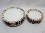 Jogo de 12 pratos em porcelana Steatita com guirlanda floral e friso ouro. Composto de 6 rasos (25cm) e 6 de sobremesa (19,5cm)