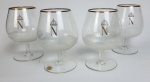Quatro taças  em cristal para conhaque. Medindo: 13 cm de altura. Um com mancha interna. 