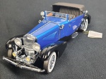 Miniatura de carro - 1933 Duesenberg j 1991 Franklin mint precision models, em metal. Medindo: 25 x 7 cm.