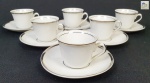 Mauá  - Seis xícaras de café em porcelana na cor branca, bordas com frisos a folha de prata (uma com imperceptível bicado na borda)