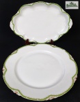 Rosenthal, Bavaria - Duas travessas em porcelana alemã na cor branca, com detalhes filetada a ouro, listra verde e bordas recortadas, sendo uma redonda e outra oval. Medindo: 30 cm e 32 x 21 cm.