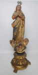 Este lote será apregoado no dia 19/11 após o lote 800......Arte Sacra - Imagem em madeira entalhada e policromada, com ricos detalhes em ouro velho e olhos de vidro, representando Nossa Senhora da Conceição. Acompanha coroa em prata.  Século XIX. Medindo: 36 cm e coroa : 4 x 3,5 cm