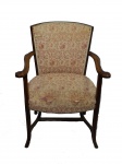 Cadeira de braços, madeira nobre, assento e encosto estofados em tecido floral, acabamento em debrum. Tecido no estado.
