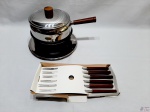 Panela de fondue com rechaud em aço inox Forma, acompanha 6 garfos de fondue da Tropic-art.