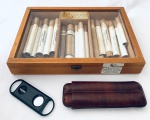 Colecionismo  Caixa de charutos da marca MR Charutos, contendo 17 charutos diversos, um cortador de charutos e um estojo para charutos.