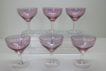 CRISTAL - Lote de 6 taças parra champanhe em cristal lapidado, bojo lilás, ricamente lapidado, haste e base  incolor e base circular. alt. 12 cm. Leves bicados.