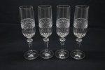 CRISTAL - Lote de 4 fluts lapidados e haste facetada. Alt. 22 cm.