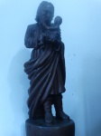Escultura em madeira de lei entalhada a mão representando São José de Botas. Peça assinada. Altura:75cm.
