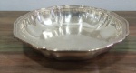 Arrozeira em metal espessurado a prata, altura 5 cm e diâmetro 24 cm.