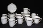 Conjunto de 11 xícaras e 15 pires para café, em porcelana branca, Real - S. Paulo, decorada com delicado relevo na borda e filetada a prata..