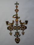 Candelabro móbile em bronze esmaltado em policromia, para 2 velas, apresenta figuras e simbologias tipicamente russas. Marcado no fundo. 41 x 21cm.