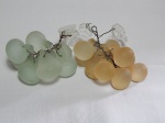 Frutas decorativas em vidro fosco verde e âmbar. Comps. 16cm.