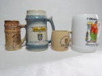 Quatro canecas em cerâmica comemorativas de festivais: "5ª Oktoberfest de Blumenau-SC 1988", "XX FEsta do Colonizador do Nova Friburgo Country Club", "13ª Festa Junina dos Estados, Brasília, 1973". Alt. maior 16cm, menor 8cm.