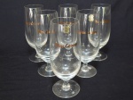 Seis tulipas para chopp em cristal aplicados com nome "McLaren" (referência ao estaleiro McLaren). Selo Hering. Alt. 16cm.