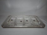BOHEMIA - Conjunto de 4 petisqueiras em cristal alemão translúcido, lapidação em canelados e denteados, sobre bandeja em metal espessurado a prata. Selo da fábrica nas petisqueiras. Petisqueira 15 x 7cm, bandeja 39 x 23cm.