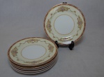 NORITAKE - Seis pratos para sobremesa em porcelana japonesa, borda com esmaltagem bege, medalhões de buquê de flores circundado por volutas e acantos interligados por guirlandas, friso grená. Marcado no fundo. Diam. 19,5cm.
