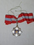 MILITARIA - "Ordem do Mérito Naval" grau Comendador, prata e esmalte, concedida para agraciar os militares da armada, nacionais ou estrangeiros, que houverem prestado assinalados serviços ao Brasil, ou se tiverem distinguido no exercício da sua profissão. Esmalte com quebrados. No estado.
