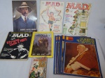COLECIONISMO - Onze (11) revistas diversas: 3 edições da Mad, 1 livro com quadrinhos Mad, 1 National Geographic, 1 sobre Santos Dummond e 5 edições especiais da revista Manchete. Alguns desgastes nas capas.