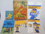 Quatro peças infantis: a) Kit para crianças oferecido pela extinta "British Caledonian Airways" composto por revistas puzzles, blocos, lápis de cores, etc. b) Três livros infantis antigos: "No Reino Delicioso da Gatinha Princeza" (no estado), "As Aventuras de Tintin na África" e "Cartinhas do Menino Jesus".
