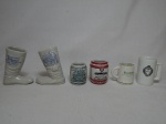 Seis peças em cerâmica promocionais; 2 copos em forma de bota, 2 copos em forma de barril e 2 canecas (1 com bicado na borda). Alt. da maior 10cm.