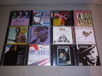 Doze CD's de diversos artistas e estilos.