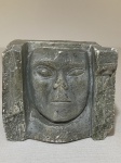 Escultura em pedra sabão representando uma `Face` ass. J. de Paschoal e datada 1973 med. 10cm