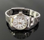 RELÓGIO ROLEX - DATEJUST LADY - WHITE DIAL ALGARISMOS ROMANOS. 31 MM DE DIAMETRO. CAIXA E PULSEIRA EM AÇO. VIDRO DE SAFIRA RESISTENTE A RISCOS, LENTE CICLOPE SOBRE A DATA, CAMBIO RÁPIDO, CRONOMETRO SUIÇO CERTIFICADO. MOVIMENTO AUTOMÁTICO CALIBRE 2235. 31 MM DIAMETRO