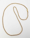 CORDÃO EM TORCEIL EM OURO TIMBRADO 18K. PRIMEIRA METADE DO SEC. XX. 70 CM DE COMPRIMENTO. 15, G
