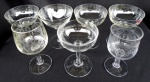 Sete taças francesas em cristal,  translúcidas  - quase todas SAINT LOUIS - com sonorização , sendo 5 ( cinco ) para champanha modelo comemoração e  2 ( duas ) para vinho. Altura de 12 a 14 cm .