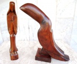 Duas esculturas em bloco de madeira de lei brasileira , ambas maciças : uma representando TUCANO e outra Nossa SENHORA. Medidas 28 cm de altura.