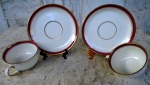 Par de xícaras com pires para café em porcelana branca com faixa fina cereja e filete  em ouro , Muito fina marcado Zoemigrelt /Germany