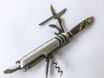 COLECIONISMO - Canivete multifunção em metal prateado. 
