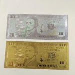 31. Numismática (2) Cédulas de 10 Dólares banhadas a Ouro Branco e Ouro Amarelo. Peças fantasia