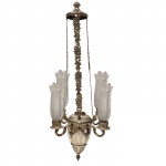 Lampadário em prata de lei batida, repuxada, cinzelada e contrastada. Acompanha quatro donzelas em cristal Baccarat. Portugal. Séc. XIX.  2.082 Kg. 80 cm de altura.