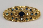 Antigo broche em Prata filigranada com incrustações de pequenas pedras azuis e brancas  . Mede: 6 cm - 14g