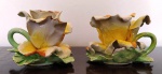 Par de palmatórias  em porcelana no formato de rosas CAPODIMONTE , rica policromia . Medem: 11 x 8 cm