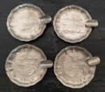 Conjunto de 4 cinzeiros em metal prateado com representação de Copacabana no Rio de Janeiro . Mede: 7 cm 