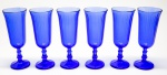 DEMI CRISTAL - Lote de 6 flus em demi cristal em tom azul, bojo decorado em relevo godrões, haste facetada e base circular. Alt. 16 cm.
