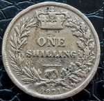 REINO UNIDO ONE SHILING 1871 PRATA .925% 5.6 GRAMAS, 23.5 MM .VALOR ESTIMADO EM CATALOGO PARA MBC 38 DOLARES ( 220,00 REAIS )