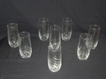 Oito copos em vidro moldado com drapeados. Alt. 14,5cm.