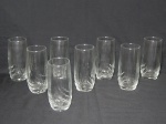 Oito copos em vidro moldado com drapeados. Alt. 14,5cm.