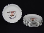 Seis (6) pratos para churrasco em porcelana nacional branca, borda com faixa preta, centro decorado com figura de churrasco. Diâm. 19cm.