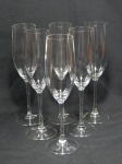 Seis flutes para champagne em vidro translúcido acondicionados em embalagem original da manufatura LUMINARC. Alt. 23cm.